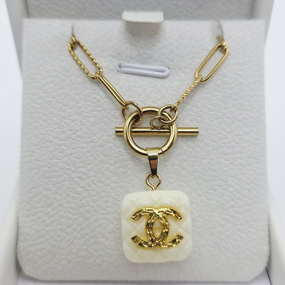 Authentic CHANEL Gold and Cream Logo Necklace. On Atolea Waterproof Chain - Picture 1 of 6